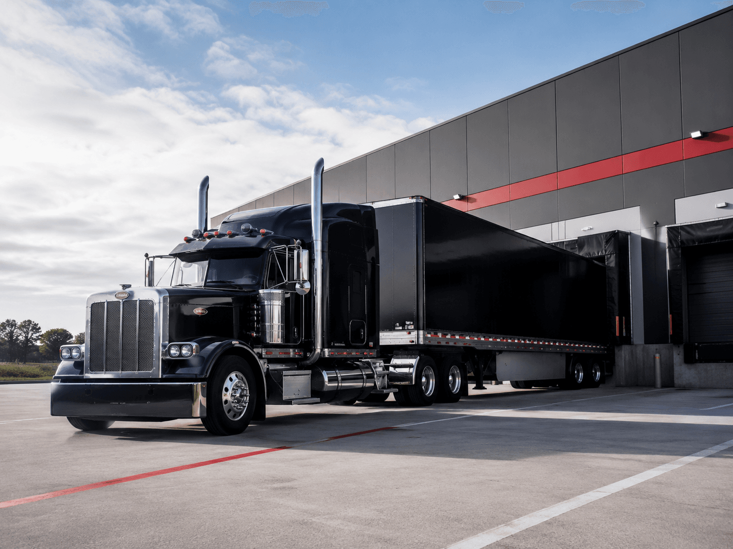 Truck parked at a modern warehouse